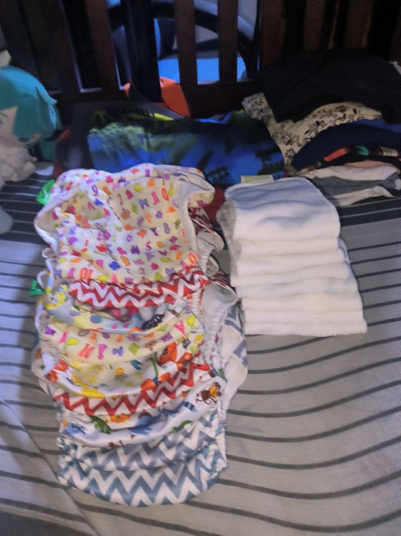 Cloth Diapers Set (Category: Diapers & Baby Wipes) located in Manila. Submitted by silent_vonachiles (Listing ID 1433721823, Image 1). Description: - Colorful cloth diaper set - Features various patterns: letters, zigzags, animal prints - Includes patterned diapers and white inserts - Reusable and washable.
