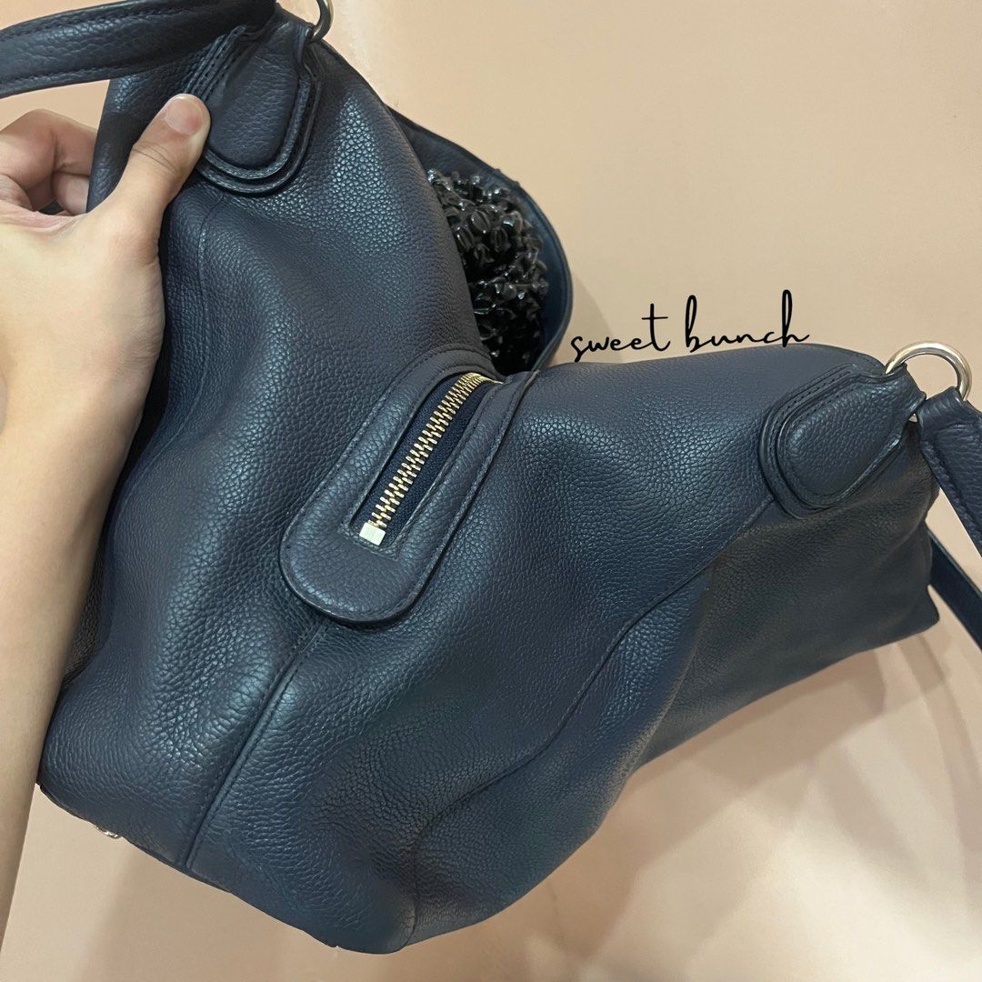 Coach Edie 31 Navy Blue Shoulder Bag (Category: Luxury Bags & Wallets) located in Taytay. Submitted by elle003 (Listing ID 1433748170, Image 3). Description: Details: - Model Number is N° D1592-36464. - Made from Pebbled Leather. - Bag comes with an ordinary dustbag. Condition: - 7/10 color rate, may scratches/sign of use sa leather and hardwares. - Yung rubber lining repaired, please take a close up view sa mga pictures po. - No hangtag. - Selli