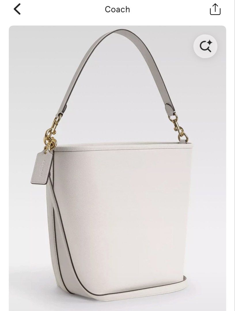 Coach City Large Bucket Bag (Category: Luxury Bags & Wallets) located in Muntinlupa City. Submitted by caseypeech (Listing ID 1433698199, Image 1). Description: - Coach City Large Bucket Bag - Stylish white exterior with black trim - Spacious interior - Versatile carrying options: top handle and detachable shoulder strap - Features Coach tag and gold-tone hardware - Interior lined with burgundy material - Bought in Rinku, Osaka/With Dustbag/Used 