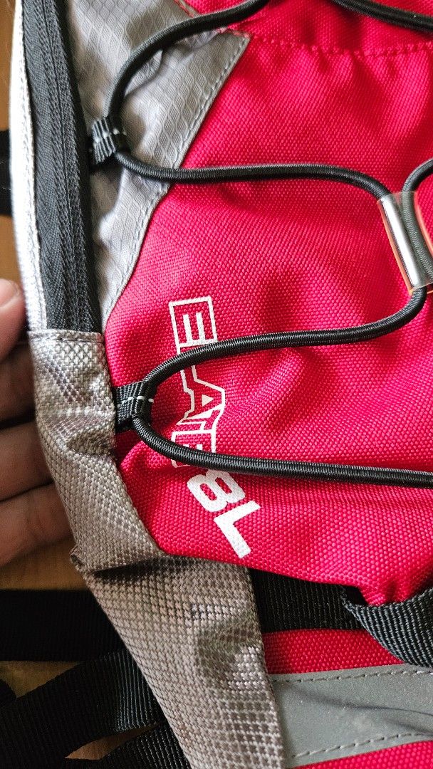 Coleman Hydration Backpack (Category: Backpacks) located in Alfonso. Submitted by jbcamet (Listing ID 1433667265, Image 2). Description: - Coleman hydration backpack - Red and gray design - Adjustable straps for a comfortable fit - Multiple compartments, including hydration reservoir space - Reflective strips for visibility.