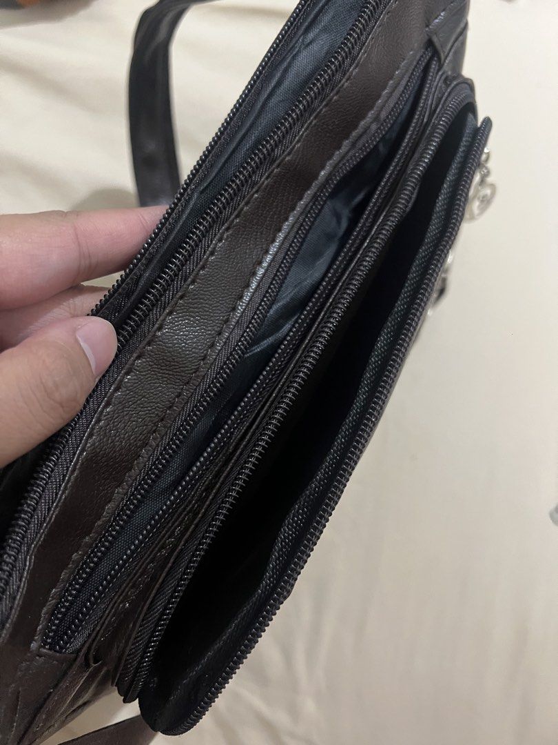 Defective bag (Category: Shoulder Bags) located in Manila. Submitted by prebyry (Listing ID 1433750335, Image 3). Description: Defective item 4 zipper compartments ❌Main zipper not zipping ❌One missing zipper Pick up available Shipping: Lalamove or J&T Location: Novaliches, Quezon City.