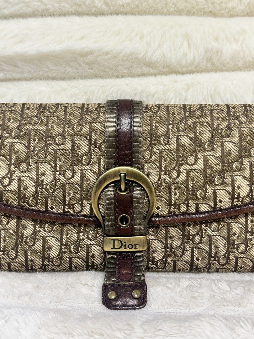 Dior Oblique Canvas Wallet (Category: Luxury Bags & Wallets) located in Cavite. Submitted by aljennaaaa (Listing ID 1433729513, Image 2). Description: - Authentic Dior wallet - Iconic Oblique canvas - Brown leather strap with gold-tone buckle - Multiple card slots - Zippered compartment - Includes dust bag - Classic design - Perfect for everyday use.