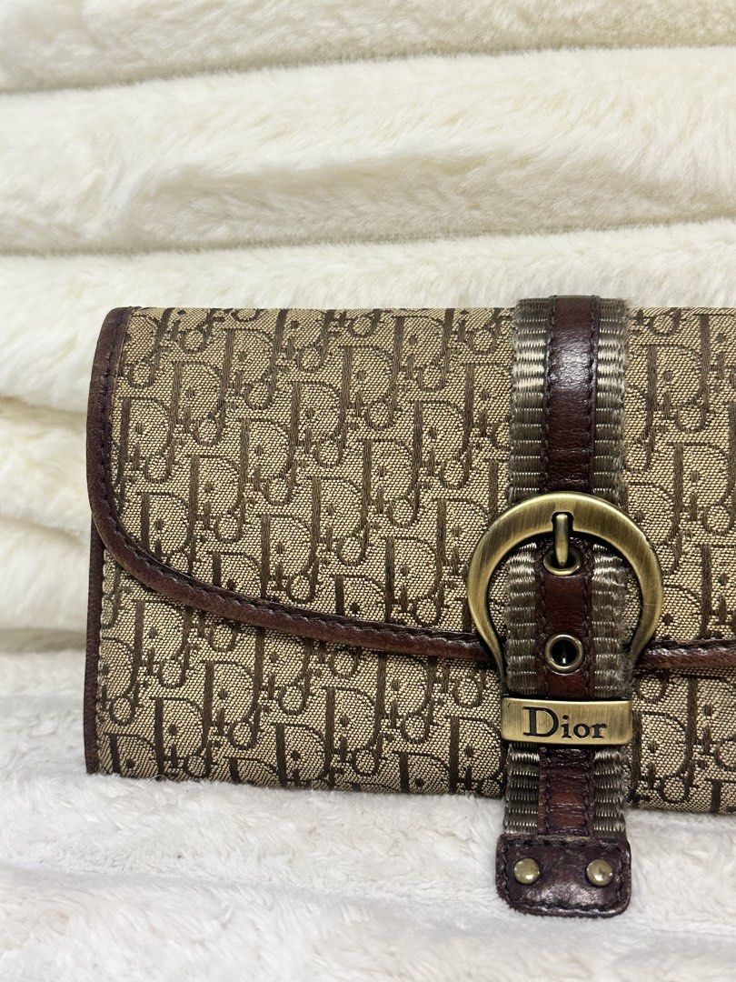 Dior Oblique Canvas Wallet (Category: Luxury Bags & Wallets) located in Cavite. Submitted by aljennaaaa (Listing ID 1433729513, Image 3). Description: - Authentic Dior wallet - Iconic Oblique canvas - Brown leather strap with gold-tone buckle - Multiple card slots - Zippered compartment - Includes dust bag - Classic design - Perfect for everyday use.