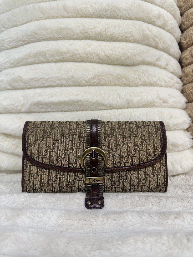 Dior Oblique Canvas Wallet (Category: Luxury Bags & Wallets) located in Cavite. Submitted by aljennaaaa (Listing ID 1433729513, Image 1). Description: - Authentic Dior wallet - Iconic Oblique canvas - Brown leather strap with gold-tone buckle - Multiple card slots - Zippered compartment - Includes dust bag - Classic design - Perfect for everyday use.
