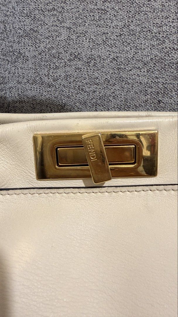 Fendi Peekaboo Black Python handle (medium size) (Category: Luxury Bags & Wallets) located in Mandaluyong City. Submitted by cdvcdv (Listing ID 1433758915, Image 3). Description: Fendi Peekaboo in ivory leather with python handle (Project Bag) This bag is being sold as a "Project Bag" and is priced accordingly. Due to improper storage, it has the following significant flaws: Leather Condition: Certain areas of the smooth ivory leather have harden