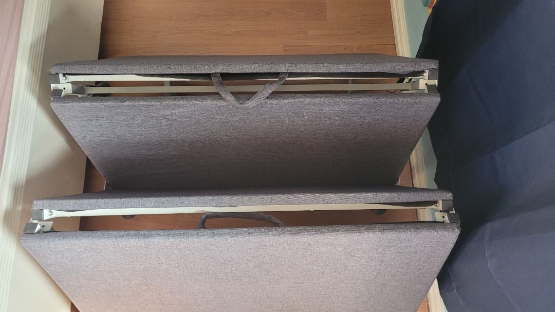 Foldable Bed with Wheels (Category: Bed Frames & Mattresses) located in Manila. Submitted by llcd_declutters (Listing ID 1433735909, Image 2). Description: - Foldable bed for guests or small spaces - Dark grey fabric - Features wheels for easy movement - Compact folding design for storage - Includes handles for carrying - Sturdy and well-made - Comfortable sleeping surface.