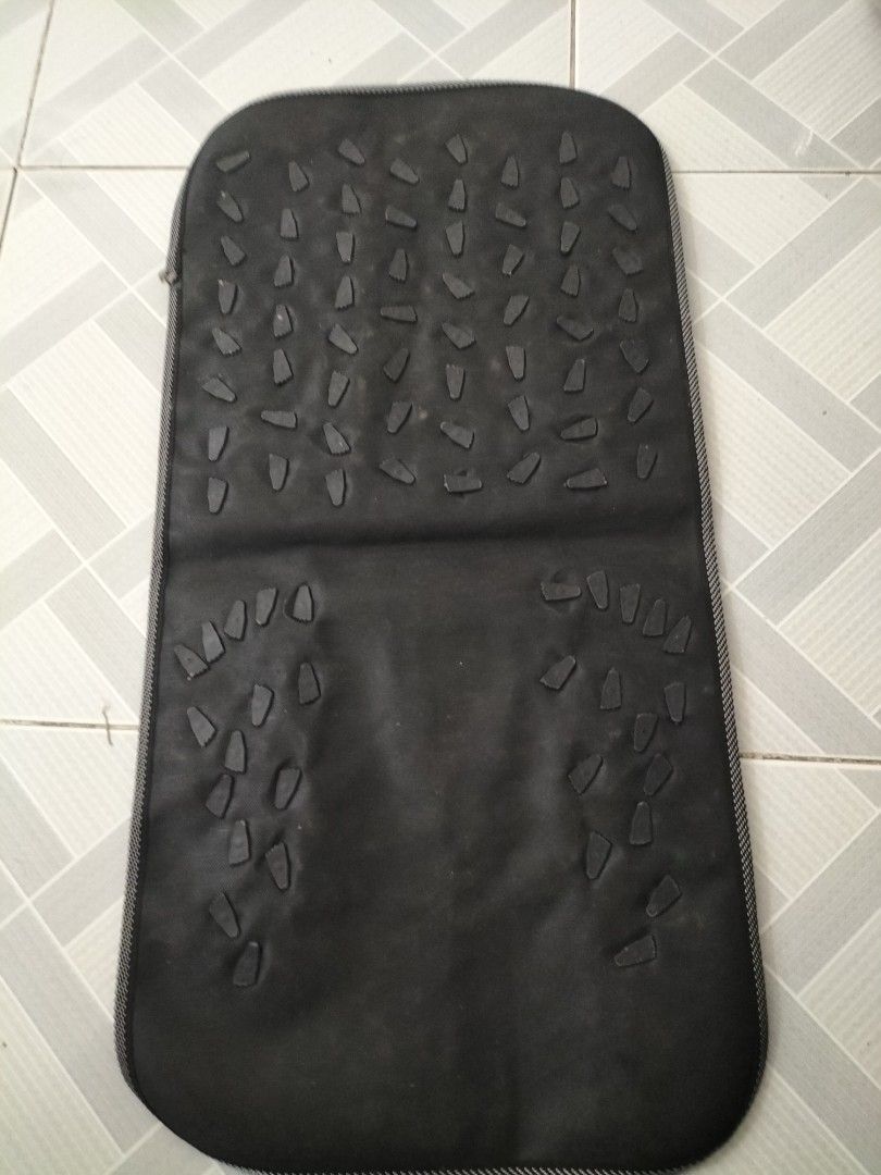 Foot Reflexology Massage Mat (Category: Massage Devices) located in Las Pinas. Submitted by declutter.with.eca (Listing ID 1433606876, Image 2). Description: - Foot massage mat with colorful reflexology nodes. - Features a black base with foot reflexology point diagram. - Foldable design for easy storage and portability. - Textured nodes on the back for added massage. - Designed to stimulate pressure points on your feet..