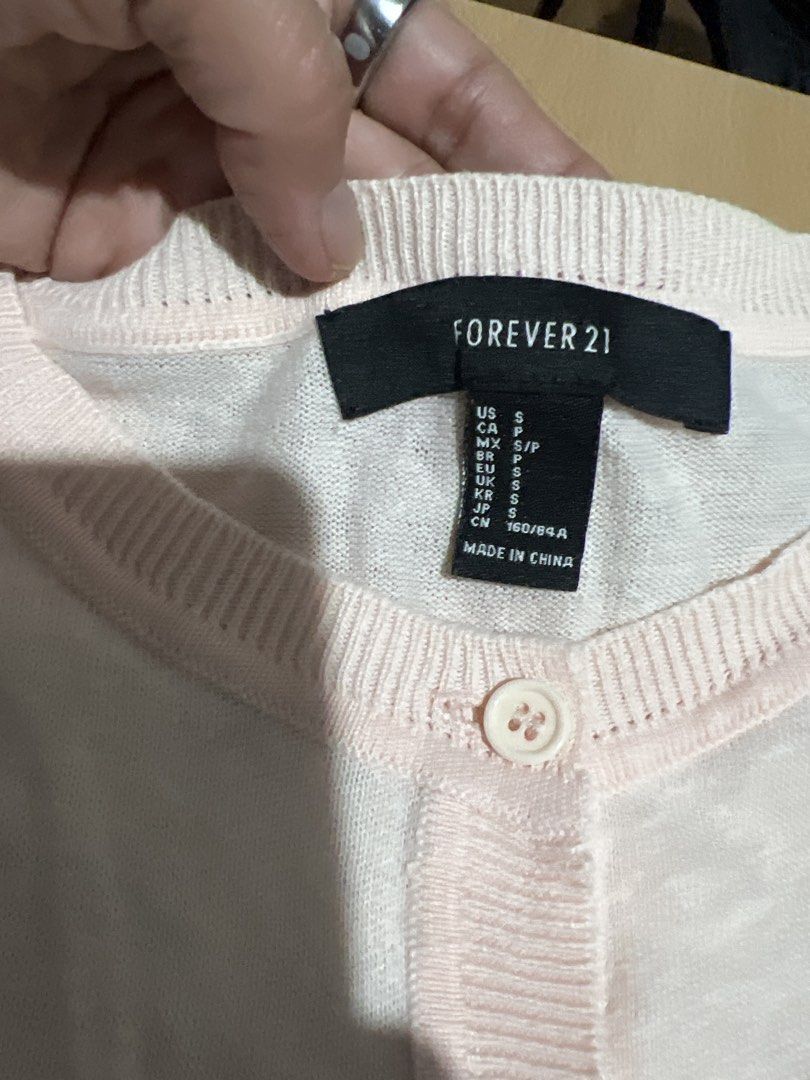 Forever 21 Pink Cardigan - Size S (Category: Coats, Jackets and Outerwear) located in Pasig City. Submitted by coattique (Listing ID 1433720370, Image 2). Description: - Forever 21 cardigan - Soft pink color - Size: Small (S) - Button-down front - Long sleeves - Made in China - Great for layering.