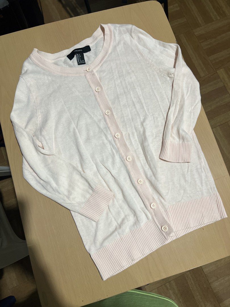 Forever 21 Pink Cardigan - Size S (Category: Coats, Jackets and Outerwear) located in Pasig City. Submitted by coattique (Listing ID 1433720370, Image 1). Description: - Forever 21 cardigan - Soft pink color - Size: Small (S) - Button-down front - Long sleeves - Made in China - Great for layering.