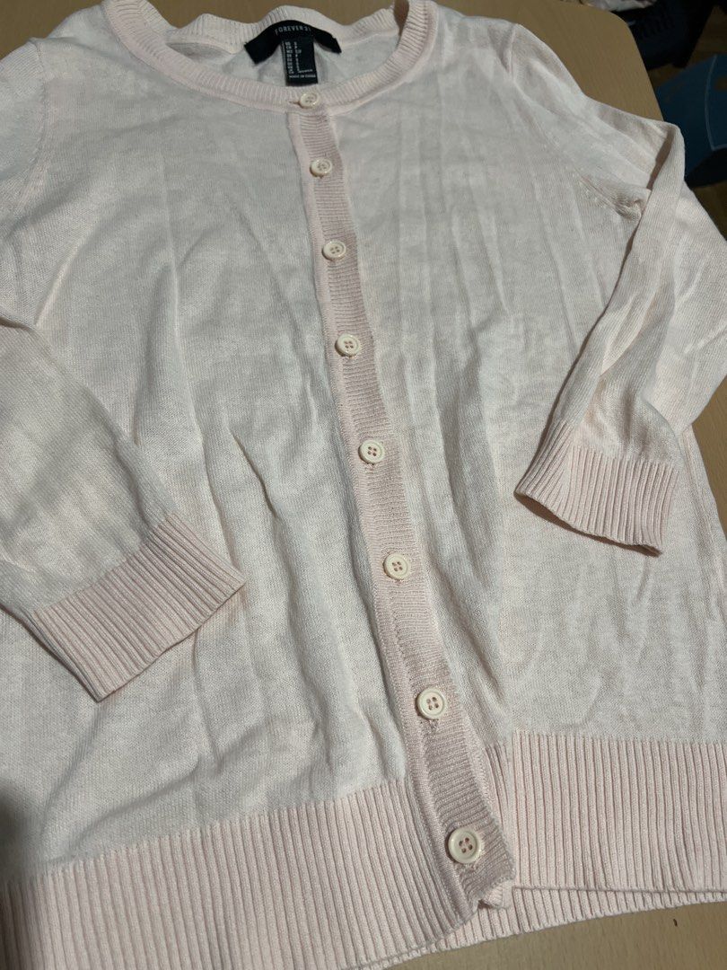 Forever 21 Pink Cardigan - Size S (Category: Coats, Jackets and Outerwear) located in Pasig City. Submitted by coattique (Listing ID 1433720370, Image 3). Description: - Forever 21 cardigan - Soft pink color - Size: Small (S) - Button-down front - Long sleeves - Made in China - Great for layering.
