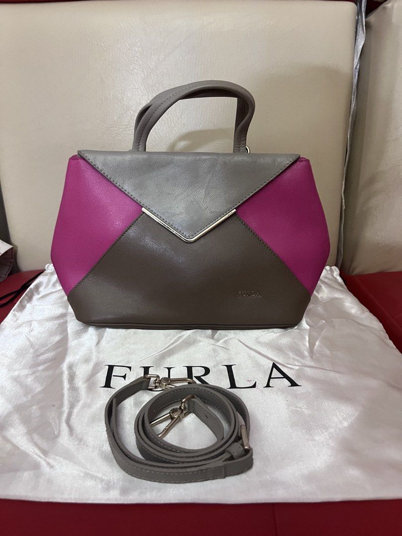 Furla Colorblock Satchel Bag (Category: Luxury Bags & Wallets) located in Victorias. Submitted by lan1877 (Listing ID 1433696705, Image 1). Description: - Authentic Furla Satchel Bag - Colorblock design: Gray, Pink, Brown - Features: - Top handle - Detachable shoulder strap - Metal clasp closure W dust bag No issue - Includes dust bag - Interior: Furla label with "Genuine Leather" print - Made in Romania 3k plus sf.