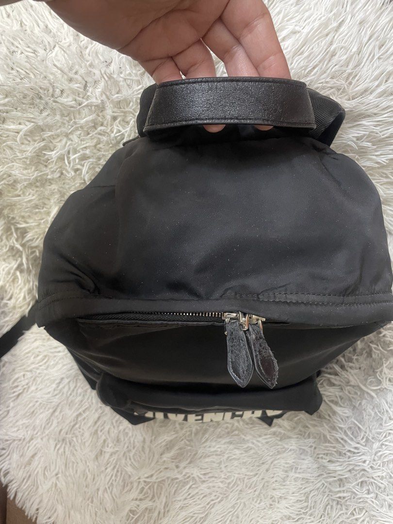 Givenchy Paris Black Backpack (Category: Backpacks) located in Quezon City. Submitted by impulse.ph (Listing ID 1433721059, Image 2). Description: - Authentic Givenchy backpack - White Givenchy Paris logo - Top handle - Adjustable shoulder straps - Multiple compartments - Zipper closure - Small front pocket - Made in Italy.