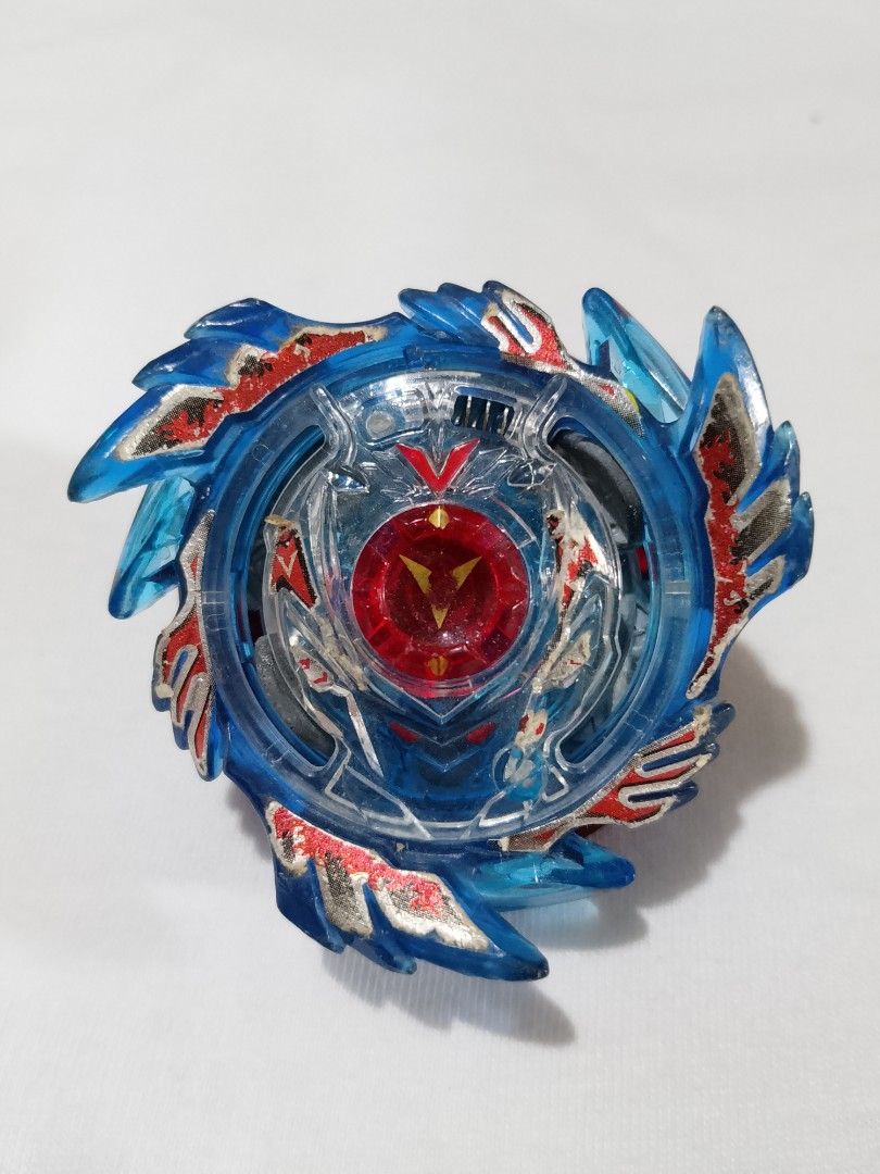 God Valkyrie Beyblade Burst B-73 Starter (Category: Action & Battle Toys) located in Victoria. Submitted by oseisan10249776 (Listing ID 1433589057, Image 1). Description: Energy Layer: God Valkyrie God Valkyrie is a right-spin Attack Type Layer. Its design and performance are characterized by the following Aesthetic Design: The layer consists of a translucent blue base with three large, upward-slanting wings. The center features a red God Chip de