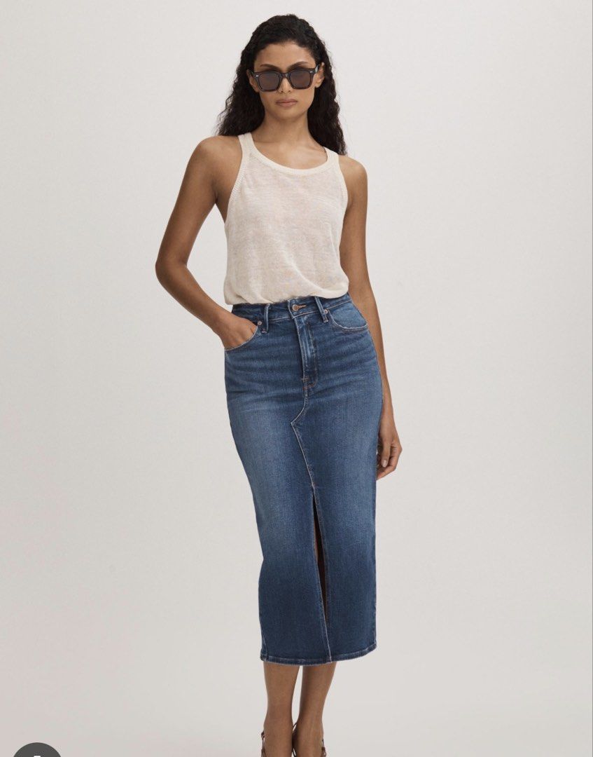 Good American Denim Midi Skirt (Category: Skirts) located in Quezon City. Submitted by sometimes_sj (Listing ID 1433593711, Image 1). Description: - Good American denim midi skirt - Size: 4/27 - Color: Medium wash blue - Features a front slit - Button and zipper closure - Comfortable fit and stretch - No flaws - RFS: don’t wear anymore.