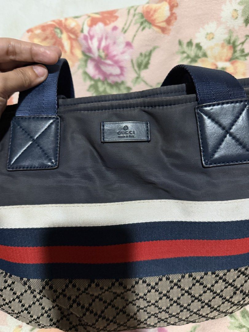 GUCCI Diamante Tote Bag (Category: Luxury Bags & Wallets) located in San Pablo. Submitted by prelovedbymistyblue (Listing ID 1433709312, Image 3). Description: Gucci diamante tote bag. With some fading on the blue nylon. Gucci underzip. With code. With signs of use on the inner lining. Measures 15.5 x 12.5 x 3.5 inches. Selling low for only 4300. .