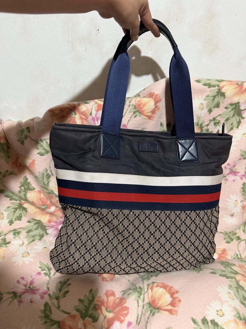 GUCCI Diamante Tote Bag (Category: Luxury Bags & Wallets) located in San Pablo. Submitted by prelovedbymistyblue (Listing ID 1433709312, Image 1). Description: Gucci diamante tote bag. With some fading on the blue nylon. Gucci underzip. With code. With signs of use on the inner lining. Measures 15.5 x 12.5 x 3.5 inches. Selling low for only 4300. .