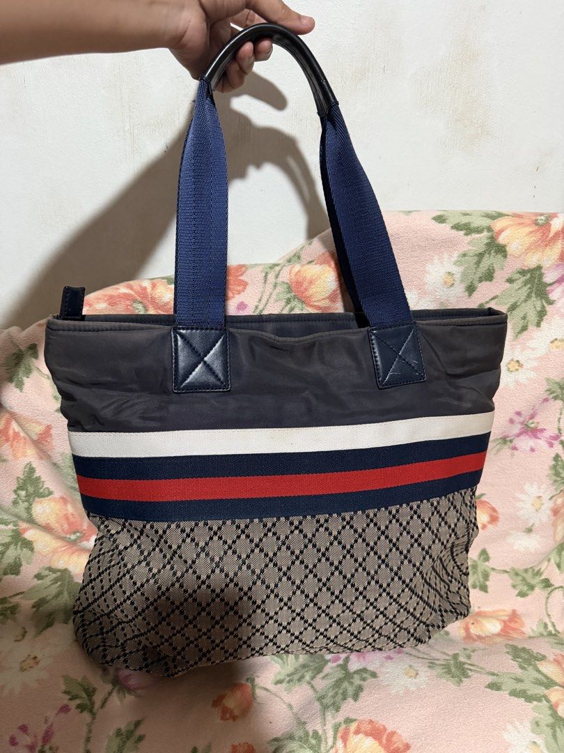 GUCCI Diamante Tote Bag (Category: Luxury Bags & Wallets) located in San Pablo. Submitted by prelovedbymistyblue (Listing ID 1433709312, Image 2). Description: Gucci diamante tote bag. With some fading on the blue nylon. Gucci underzip. With code. With signs of use on the inner lining. Measures 15.5 x 12.5 x 3.5 inches. Selling low for only 4300. .