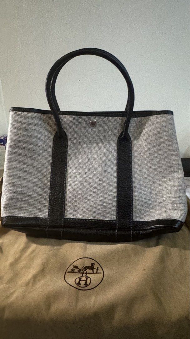 Hermes Garden Party Tote 36 (Category: Luxury Bags & Wallets) located in Marikina City. Submitted by fmcbt (Listing ID 1433751717, Image 2). Description: Authentic Hermes Garden Party tote bag - Grey canvas body with black leather trim and handles. - Snap closure. - Spacious interior. - Includes dust bag. - Sturdy handles with signs of use. - Black leather reinforced corners and base. RFS: Decluttering Can do meet ups: Manila, Makati, or Pasay.