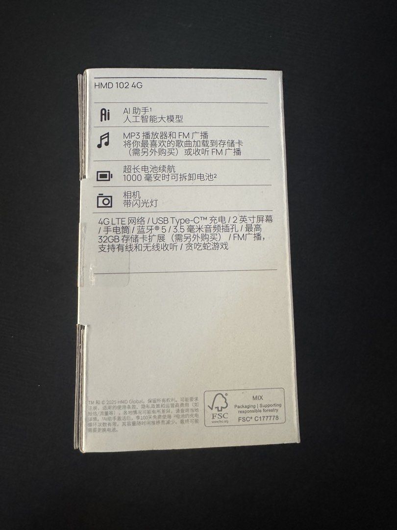 HMD 102 4G Mobile Phone (NOKIA) (Category: Early Generation Mobile Phones) located in Trece Martires City. Submitted by lakingking (Listing ID 1433668682, Image 2). Description: - HMD 102 4G Mobile Phone - 4G LTE connectivity - USB Type-C charging - 2-inch screen - 3.5mm headphone jack - Supports up to 32GB storage - FM radio - 1000mAh battery - Color: Purple (as indicated on the box).