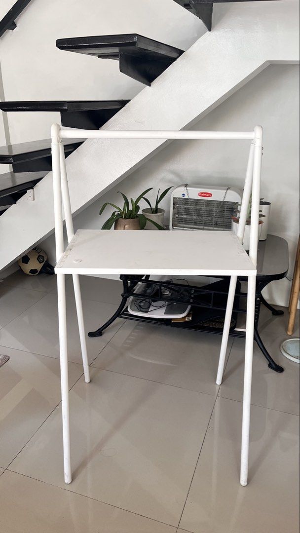 IKEA BJÖRKÅSEN Folding Table - White (Category: Tables & Sets) located in Las Pinas. Submitted by joweedeclutters (Listing ID 1433697144, Image 1). Description: - IKEA BJÖRKÅSEN folding table - Color: White - Dimensions: 59x35 cm - Features: - Foldable design for easy storage - Suitable as a laptop table or small desk - Condition: Shows wear along the edges of the tabletop Purchased last year and well maintained. There’s just tape adhesive residu