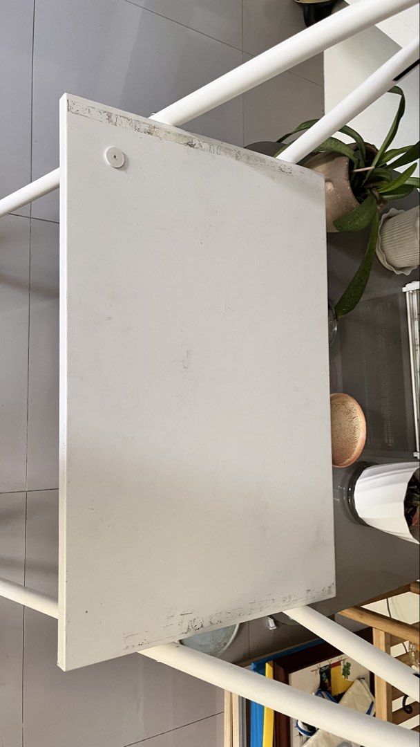 IKEA BJÖRKÅSEN Folding Table - White (Category: Tables & Sets) located in Las Pinas. Submitted by joweedeclutters (Listing ID 1433697144, Image 2). Description: - IKEA BJÖRKÅSEN folding table - Color: White - Dimensions: 59x35 cm - Features: - Foldable design for easy storage - Suitable as a laptop table or small desk - Condition: Shows wear along the edges of the tabletop Purchased last year and well maintained. There’s just tape adhesive residu