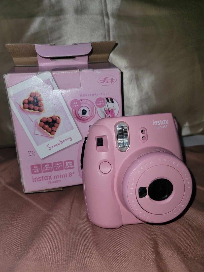Instax Mini 8+ Instant Camera (Category: Cameras) located in Dagupan City. Submitted by nikoal (Listing ID 1433676620, Image 3). Description: - Pink Instax Mini 8+ instant camera - Includes original box - 60mm focus lens - Built-in flash - Comes with a strap - Box features heart-shaped strawberry photo.