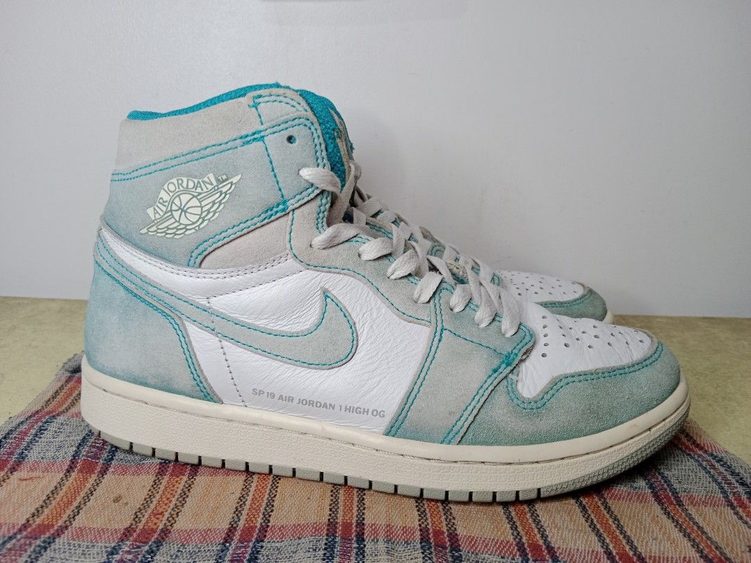 Jordan 1 Turbo Green Size 8 (Category: Sneakers) located in Caloocan City. Submitted by michaelmp2026 (Listing ID 1433678653, Image 2). Description: - Air Jordan 1 Turbo Green sneakers - Size 8 - White leather base - Teal suede overlays - Nike swoosh visible - Teal tongue and collar.