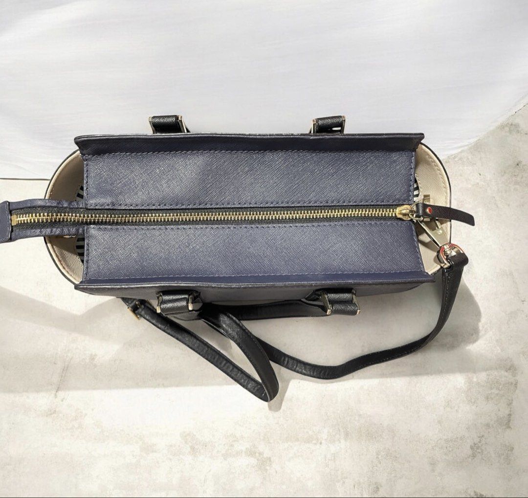 Kate Spade Two-Tone Satchel - Navy/Cream (Category: Luxury Bags & Wallets) located in Las Pinas. Submitted by lunaballoona (Listing ID 1433669864, Image 3). Description: - Kate Spade Two-Tone Satchel - Navy and Cream color - Includes bag and detachable long strap - Secure zip top closure - Stylish and versatile handbag.