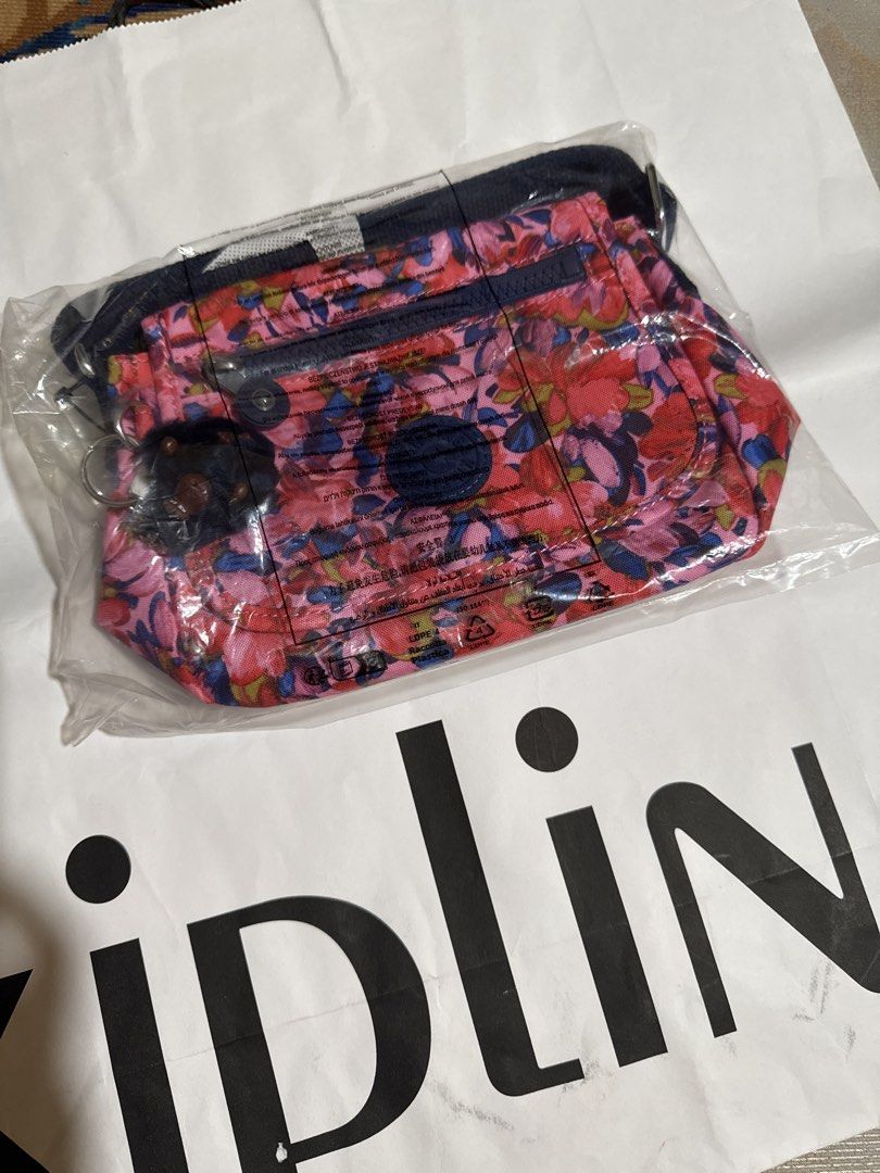 Kipling Sabian Pleasing Petals Crossbody Bag (Category: Cross-body Bags) located in Quezon City. Submitted by thebubbly (Listing ID 1433464350, Image 3). Description: - Kipling Sabian crossbody bag - Eye-catching floral print - Main compartment with zipper - Adjustable shoulder strap - Includes signature monkey keychain - Front zippered pocket - Secure flap closure - Vibrant color scheme: pink, red, blue, and purple.