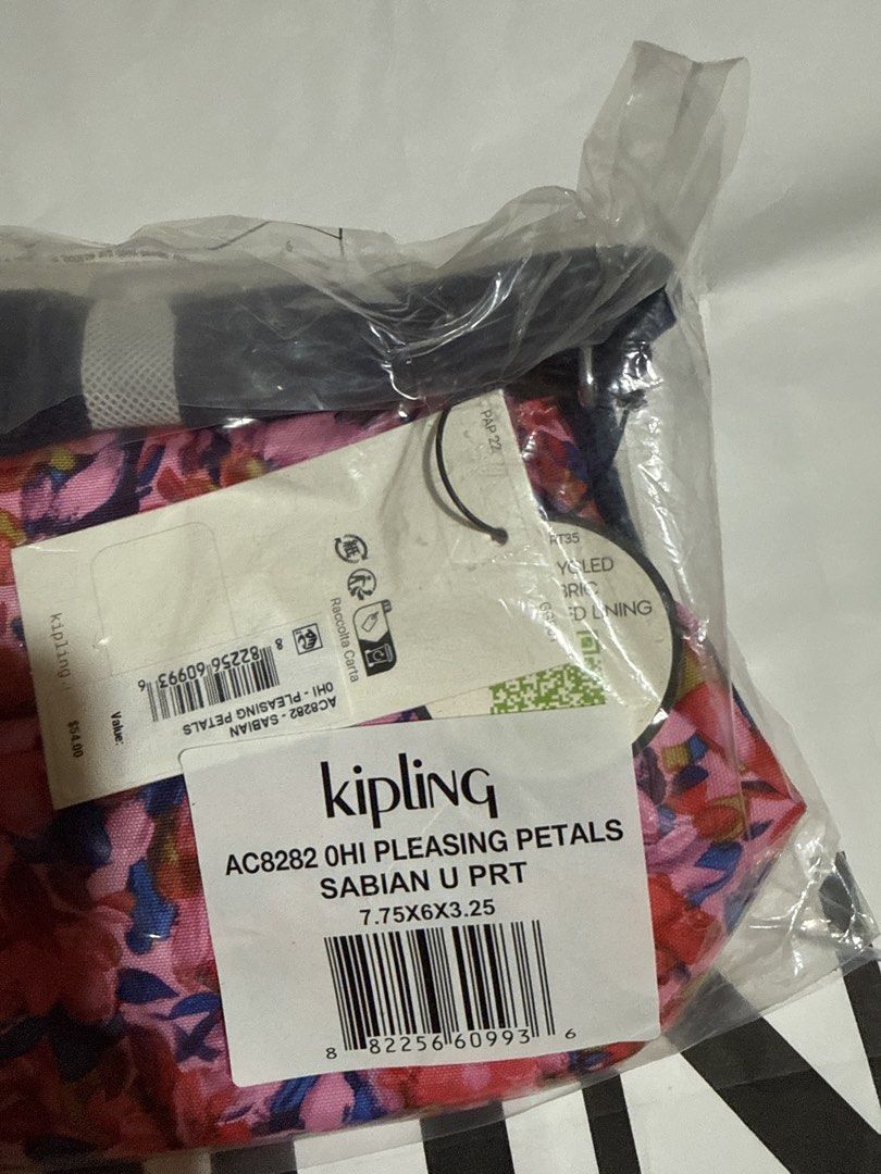 Kipling Sabian Pleasing Petals Crossbody Bag (Category: Cross-body Bags) located in Quezon City. Submitted by thebubbly (Listing ID 1433464350, Image 2). Description: - Kipling Sabian crossbody bag - Eye-catching floral print - Main compartment with zipper - Adjustable shoulder strap - Includes signature monkey keychain - Front zippered pocket - Secure flap closure - Vibrant color scheme: pink, red, blue, and purple.