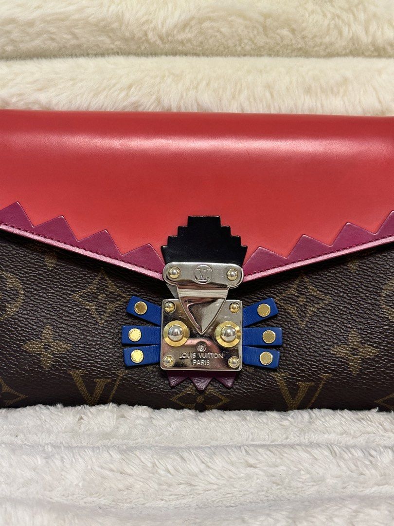 Louis Vuitton Chain Wallet (Category: Luxury Bags & Wallets) located in Cavite. Submitted by aljennaaaa (Listing ID 1433729365, Image 2). Description: - Authentic Louis Vuitton Chain Wallet - Iconic Monogram Canvas - Red Leather Flap - Silver Chain Strap - Unique Clasp Design - Multiple Card Slots - Zippered Compartment - Compact Size - Perfect for Everyday or Special Occasions.