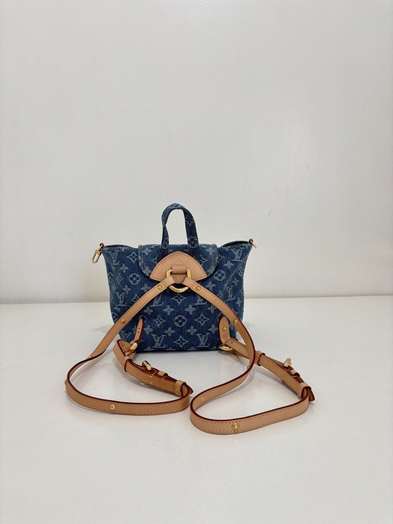 Louis Vuitton Denim Mini Backpack (Category: Luxury Bags & Wallets) located in Dagupan City. Submitted by raregrail.co (Listing ID 1433636978, Image 2). Description: - Authentic Louis Vuitton Mini Backpack - Denim exterior with LV monogram - Top handle and adjustable straps - Flap closure with gold-tone clasp - Two front pockets - Denim interior with small pocket - Made in France.