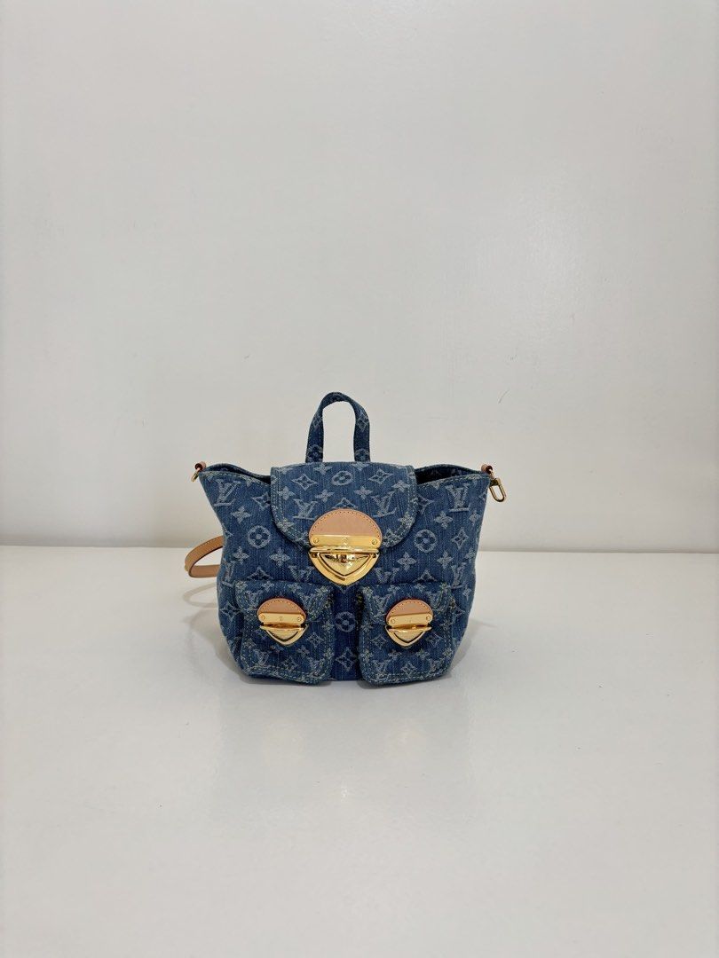 Louis Vuitton Denim Mini Backpack (Category: Luxury Bags & Wallets) located in Dagupan City. Submitted by raregrail.co (Listing ID 1433636978, Image 1). Description: - Authentic Louis Vuitton Mini Backpack - Denim exterior with LV monogram - Top handle and adjustable straps - Flap closure with gold-tone clasp - Two front pockets - Denim interior with small pocket - Made in France.