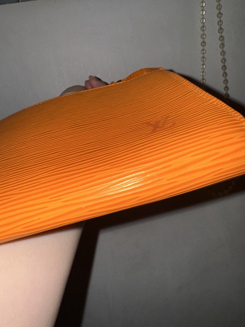 Louis Vuitton Epi Pochette Orange (Category: Luxury Bags & Wallets) located in Mandaluyong City. Submitted by helpmedeclutter123 (Listing ID 1433744259, Image 3). Description: - Authentic Louis Vuitton Epi Pochette - Vibrant orange Epi leather - Sleek, rectangular design - Top zip closure - Textured Epi leather finish.