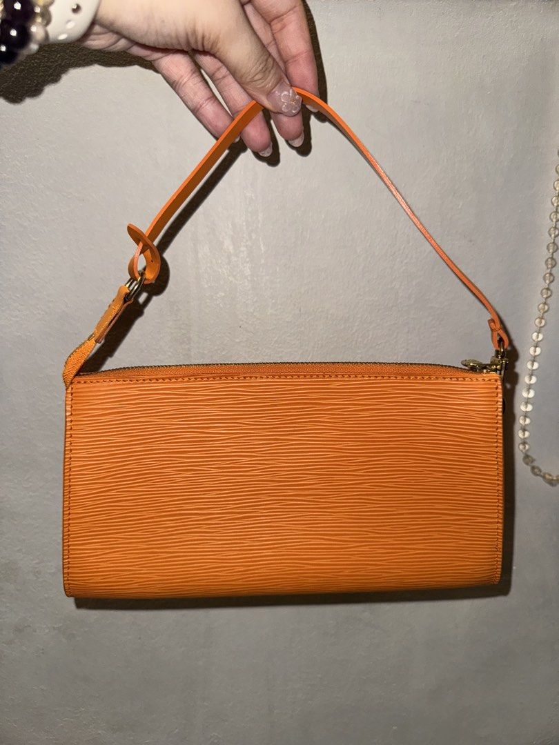 Louis Vuitton Epi Pochette Orange (Category: Luxury Bags & Wallets) located in Mandaluyong City. Submitted by helpmedeclutter123 (Listing ID 1433744259, Image 2). Description: - Authentic Louis Vuitton Epi Pochette - Vibrant orange Epi leather - Sleek, rectangular design - Top zip closure - Textured Epi leather finish.