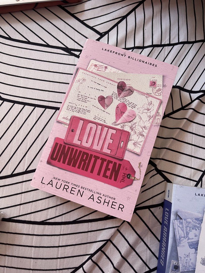 Love Unwritten by Lauren Asher (Category: Storybooks) located in Antipolo. Submitted by trix.0429 (Listing ID 1433744066, Image 1). Description: - "Love Unwritten" by Lauren Asher (Lakefront Billionaires series) for sale. - Features a pink cover. - Author's name visible. - Title clearly displayed..