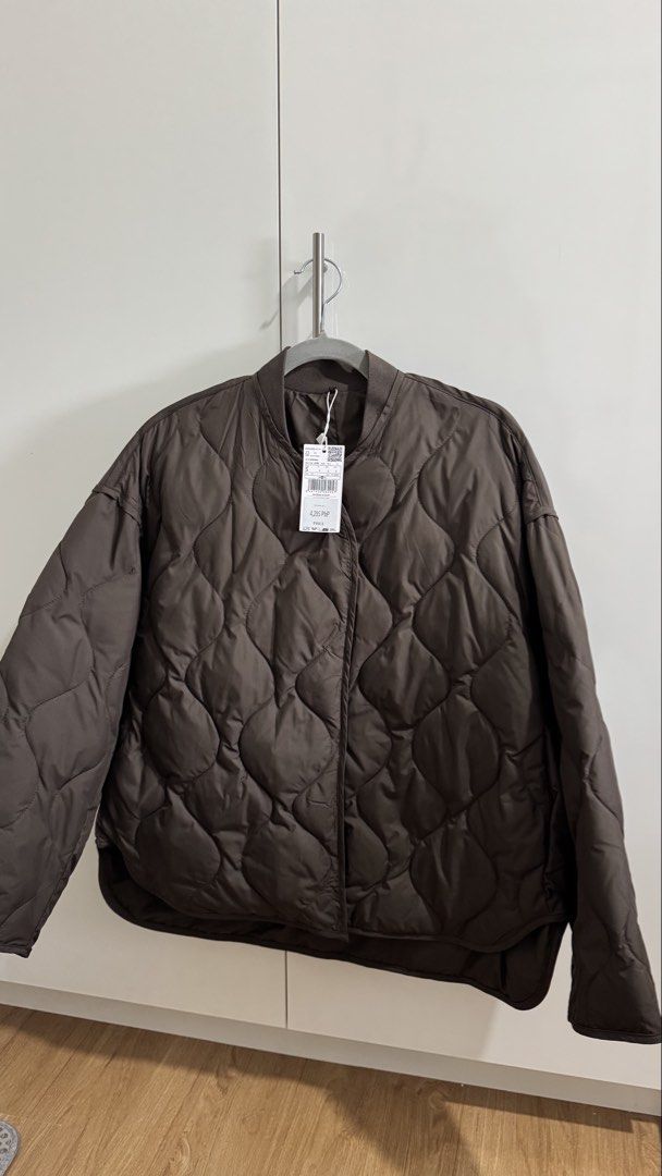 Mango Oversized Quilted Anorak Jacket (Category: Coats, Jackets and Outerwear) located in Marikina City. Submitted by prelovedbybaci (Listing ID 1433631030, Image 1). Description: Mango Quilted Jacket - Size: S - Color: Brown - Original Price: ₱4,295 - Never used; with price tag RFS: My trip got cancelled! Nowhere to use it. .