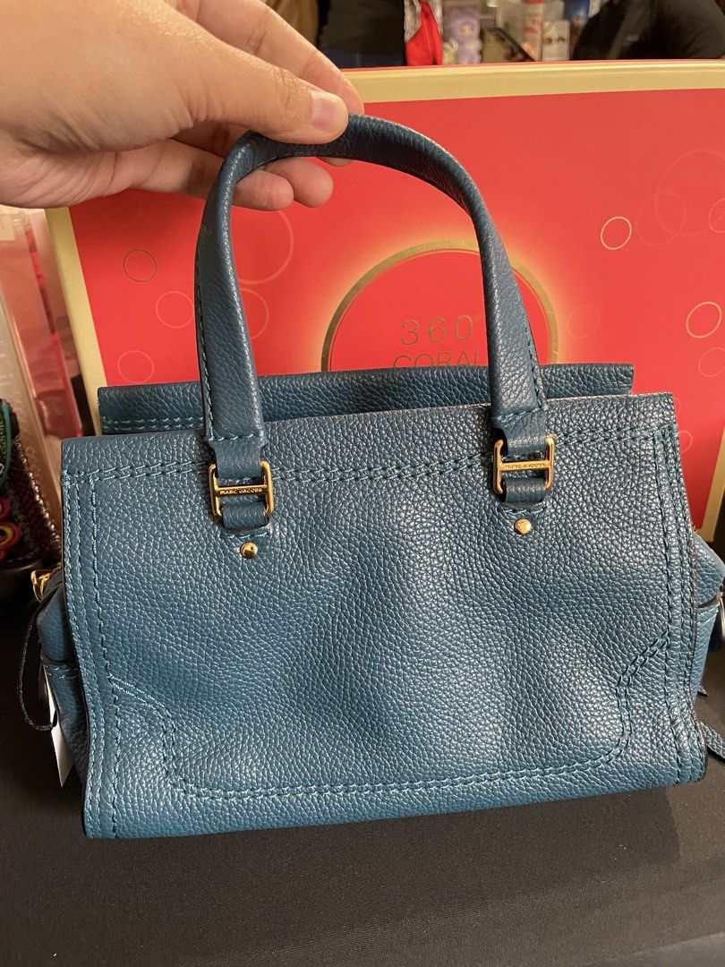 Marc Jacobs Mini Cruiser Bag (Category: Luxury Bags & Wallets) located in Quezon City. Submitted by sashiimii1720 (Listing ID 1433750136, Image 2). Description: - Original Marc Jacobs Mini Cruiser Pebbled Leather Crossbody Bag in Deep Teal - Top handle with detachable, adjustable shoulder strap - Zip closure - Size: 6” H x 8.5” W x 4” D - US Bought 🇺🇸 - With care card NOTE: With minor flaw on the handle (pls see last photo).