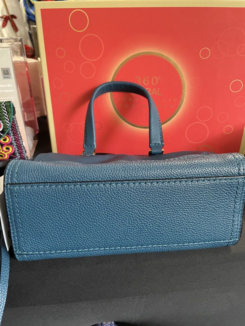 Marc Jacobs Mini Cruiser Bag (Category: Luxury Bags & Wallets) located in Quezon City. Submitted by sashiimii1720 (Listing ID 1433750136, Image 3). Description: - Original Marc Jacobs Mini Cruiser Pebbled Leather Crossbody Bag in Deep Teal - Top handle with detachable, adjustable shoulder strap - Zip closure - Size: 6” H x 8.5” W x 4” D - US Bought 🇺🇸 - With care card NOTE: With minor flaw on the handle (pls see last photo).