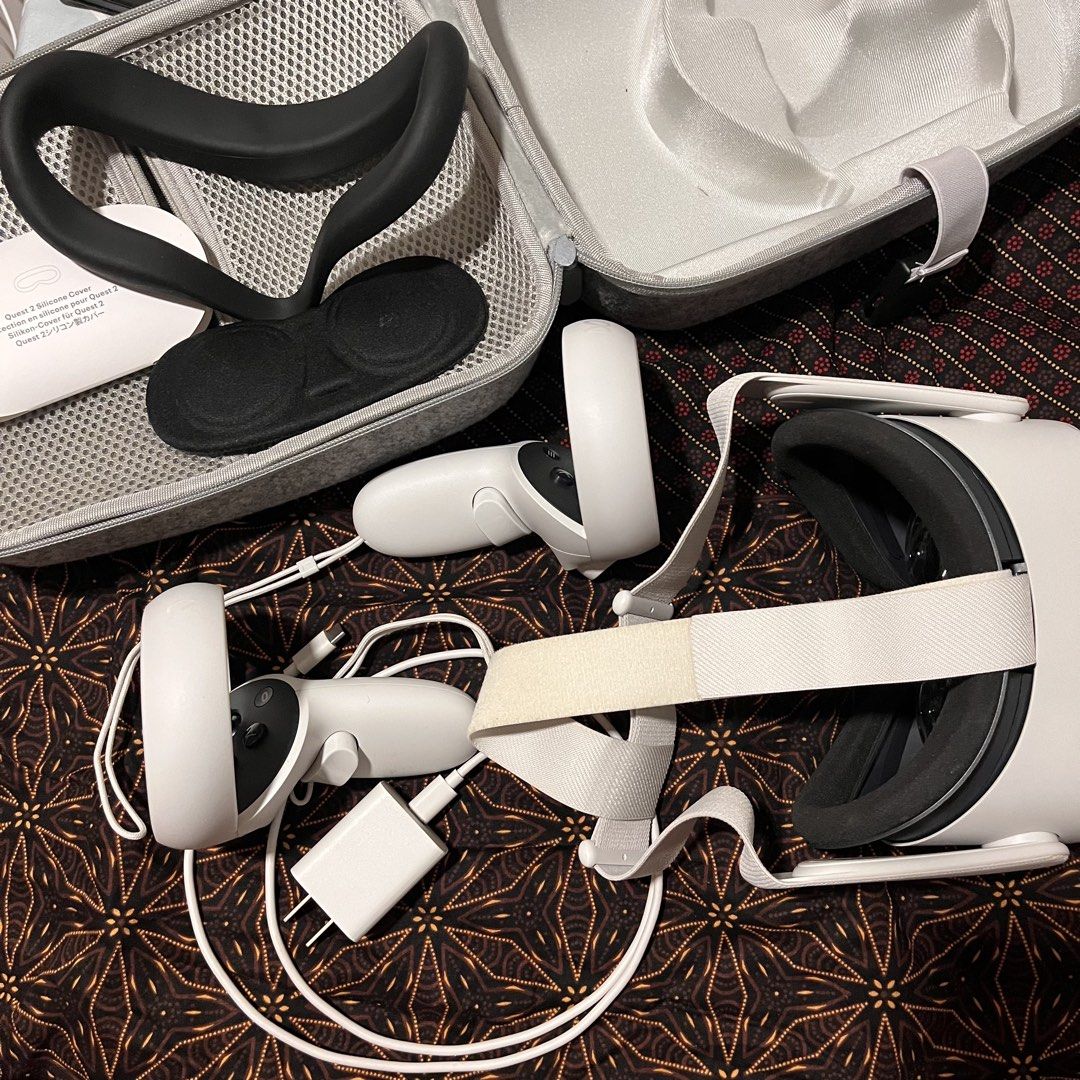 Meta Quest 2 Oculus VR Headset and Controller (Category: Virtual Reality) located in Quezon City. Submitted by coolocean.72ed16 (Listing ID 1433745227, Image 1). Description: RUSH SELLING due to relocation! - Meta Quest 2 VR headset with accessories. - 128GB - Includes: Headset, two controllers, charging cable, power adapter, facial interface, and carrying case. - Clean lenses. - Functional controllers with buttons and joysticks. - Adjustable hea