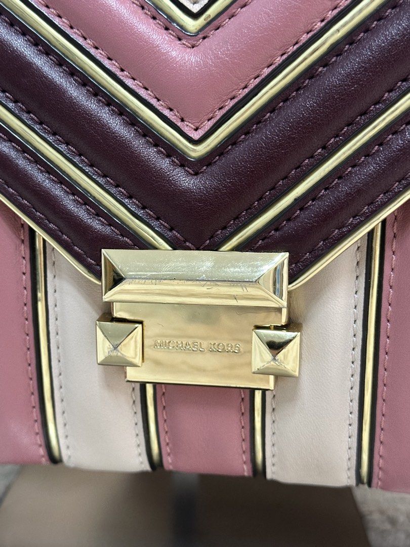 Michael Kors Whitney Leather Shoulder Bag (Category: Luxury Bags & Wallets) located in Cavite. Submitted by aljennaaaa (Listing ID 1433690610, Image 2). Description: - Michael Kors shoulder bag - Gold chain strap - Flap closure with logo - Color scheme: burgundy, pink, and cream - Interior pocket - Includes dust bag - Solid burgundy back.