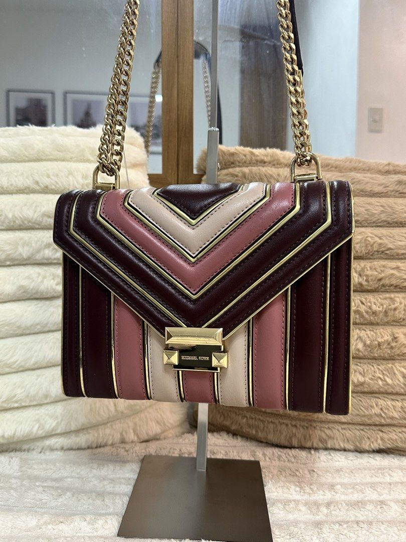 Michael Kors Whitney Leather Shoulder Bag (Category: Luxury Bags & Wallets) located in Cavite. Submitted by aljennaaaa (Listing ID 1433690610, Image 1). Description: - Michael Kors shoulder bag - Gold chain strap - Flap closure with logo - Color scheme: burgundy, pink, and cream - Interior pocket - Includes dust bag - Solid burgundy back.