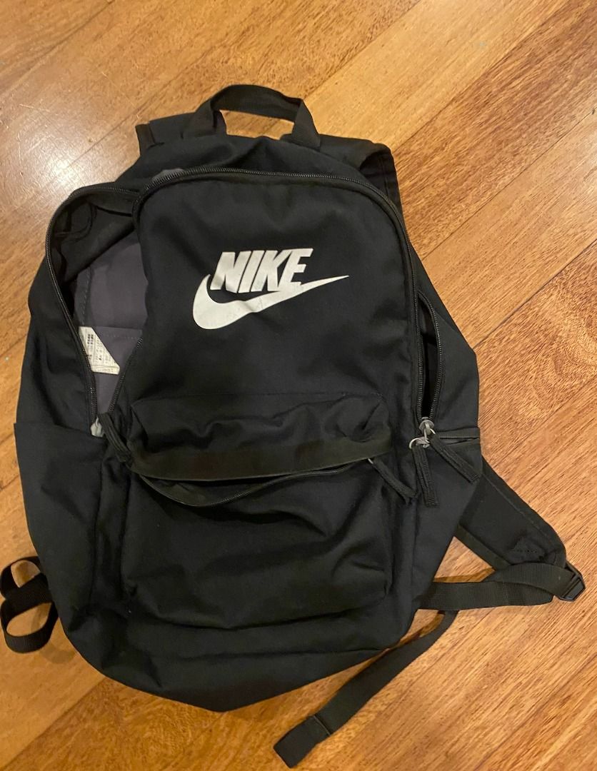 Nike Backpack (Category: Backpacks) located in Sungai Buloh. Submitted by jc9822 (Listing ID 1433715313, Image 1). Description: - Black Nike backpack - Main compartment and front pocket - Adjustable shoulder straps - Nike logo on front - Clean interior - Ideal for books, laptops, and essentials - Perfect for school, work, or travel.