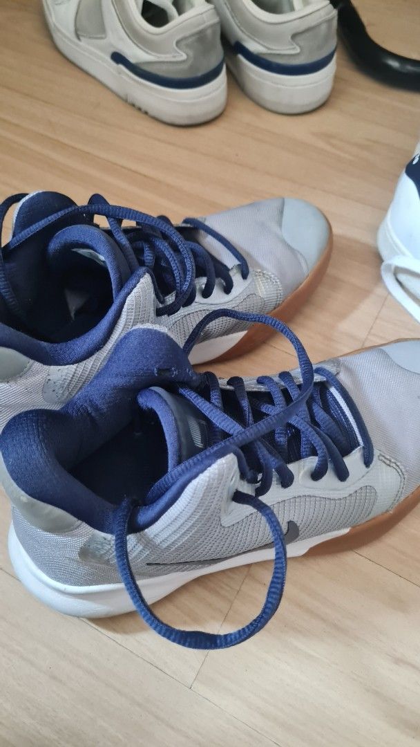 Nike Basketball Shoes - Size 6 (Category: Babies & Kids Fashion) located in Pasig City. Submitted by rakel10 (Listing ID 1433648389, Image 2). Description: - Nike basketball shoes - Color: Grey and navy blue - Low-top design - Size 6 - Model: AQ7495-008 - Features lace-up closure and rubber sole - Nike logo visible - Stored in the cabinet for some time, so some light cleaning may be needed. - Please manage your expectations, as this is a pre-love