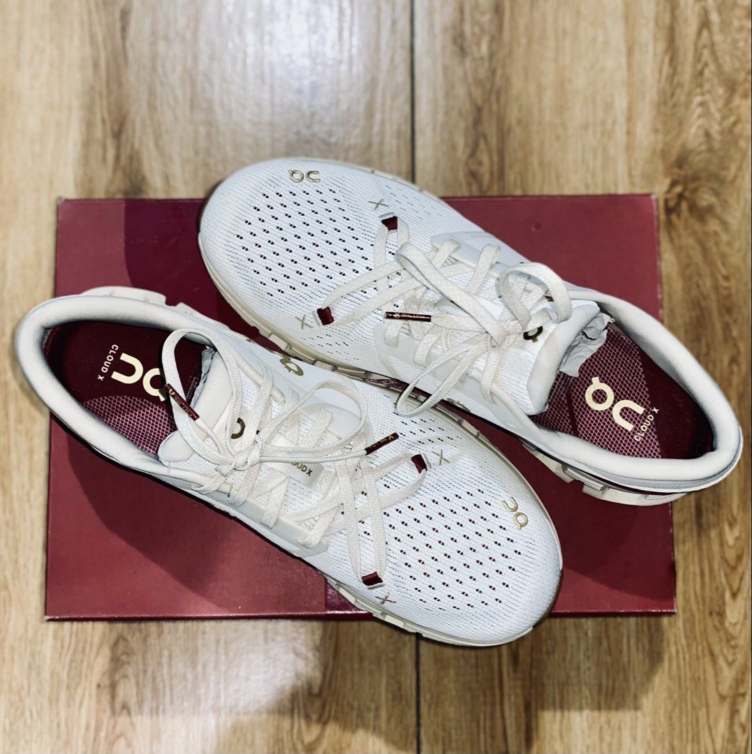 On Cloud X 4 Pearl Ivory Running Shoes (Category: Sneakers) located in Manila. Submitted by jamesdabeanstalk (Listing ID 1433710975, Image 3). Description: - On Cloud X 4 running shoes - Color: Pearl Ivory - Breathable mesh upper - CloudTec sole for cushioning - Sleek design with gold accents - Burgundy interior - Comes with original box - Perfect for running and everyday wear.