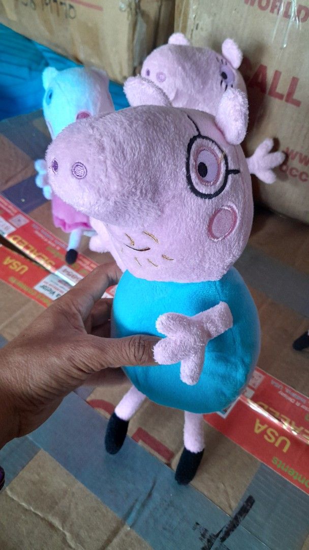 Peppa Pig Plush Toys (Category: Plushies & Soft Toys) located in Compostela. Submitted by usitems (Listing ID 1433652825, Image 2). Description: - Adorable Peppa Pig plush toy set. - Each toy has a unique outfit and expression. - Made of soft, plush material. - Suitable for children of all ages. - Features various colors: pink, orange, blue, and red. - Ideal for playtime and collecting..