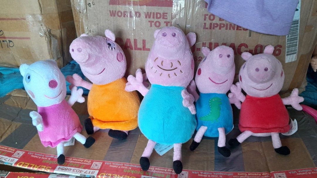 Peppa Pig Plush Toys (Category: Plushies & Soft Toys) located in Compostela. Submitted by usitems (Listing ID 1433652825, Image 1). Description: - Adorable Peppa Pig plush toy set. - Each toy has a unique outfit and expression. - Made of soft, plush material. - Suitable for children of all ages. - Features various colors: pink, orange, blue, and red. - Ideal for playtime and collecting..