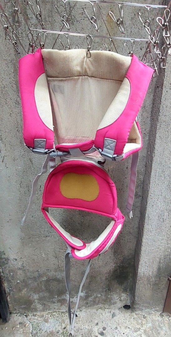 Piccolo baby carrier (Category: Carriers & Slings) located in Manila. Submitted by lewy_ernitas (Listing ID 1433632910, Image 2). Description: - Vibrant pink color - Mesh back for breathability - Adjustable straps for a comfortable fit - Supports baby's head and body - Simple and functional design.