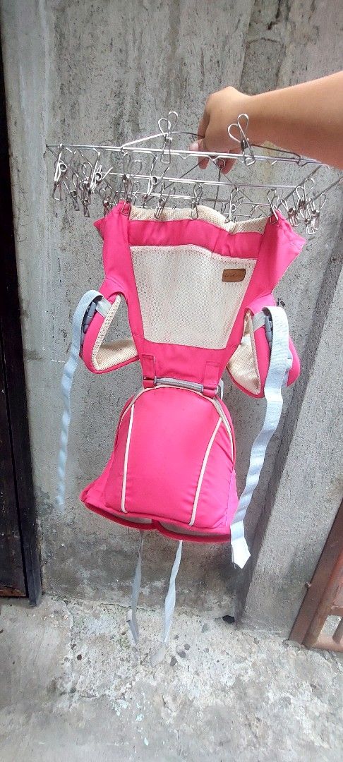 Piccolo baby carrier (Category: Carriers & Slings) located in Manila. Submitted by lewy_ernitas (Listing ID 1433632910, Image 1). Description: - Vibrant pink color - Mesh back for breathability - Adjustable straps for a comfortable fit - Supports baby's head and body - Simple and functional design.