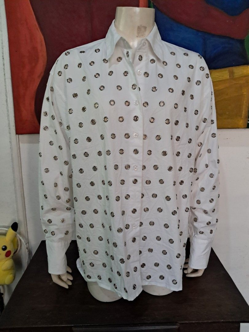 Prada Eyelet-Embellished Cotton Shirt - White (Category: Shirts) located in Manila. Submitted by msaludo (Listing ID 1433781749, Image 3). Description: Good condition Missing main label - Authentic Prada shirt - Eyelet-embellished design - Color: White - Size: 36 - Made in Italy - Fabric: 100% cotton - Features long sleeves and classic collar - Versatile for various occasions.